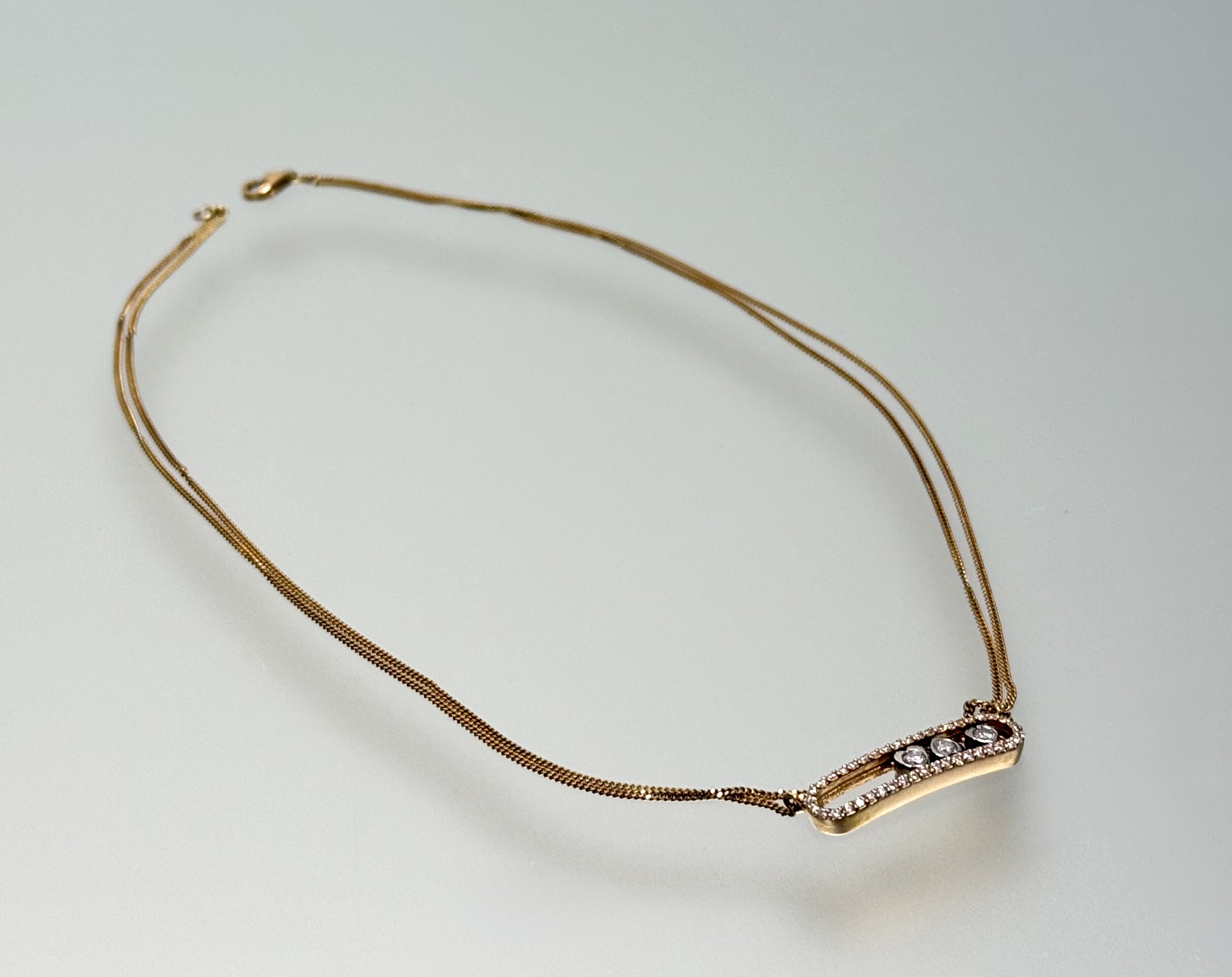 An 18ct rose gold and diamond "Move" necklace in the style of Messika, Paris, the central oval - Image 2 of 2