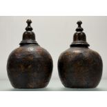 A pair of 19th century decoupage pottery urns, applied with figures and flowers, and with domed