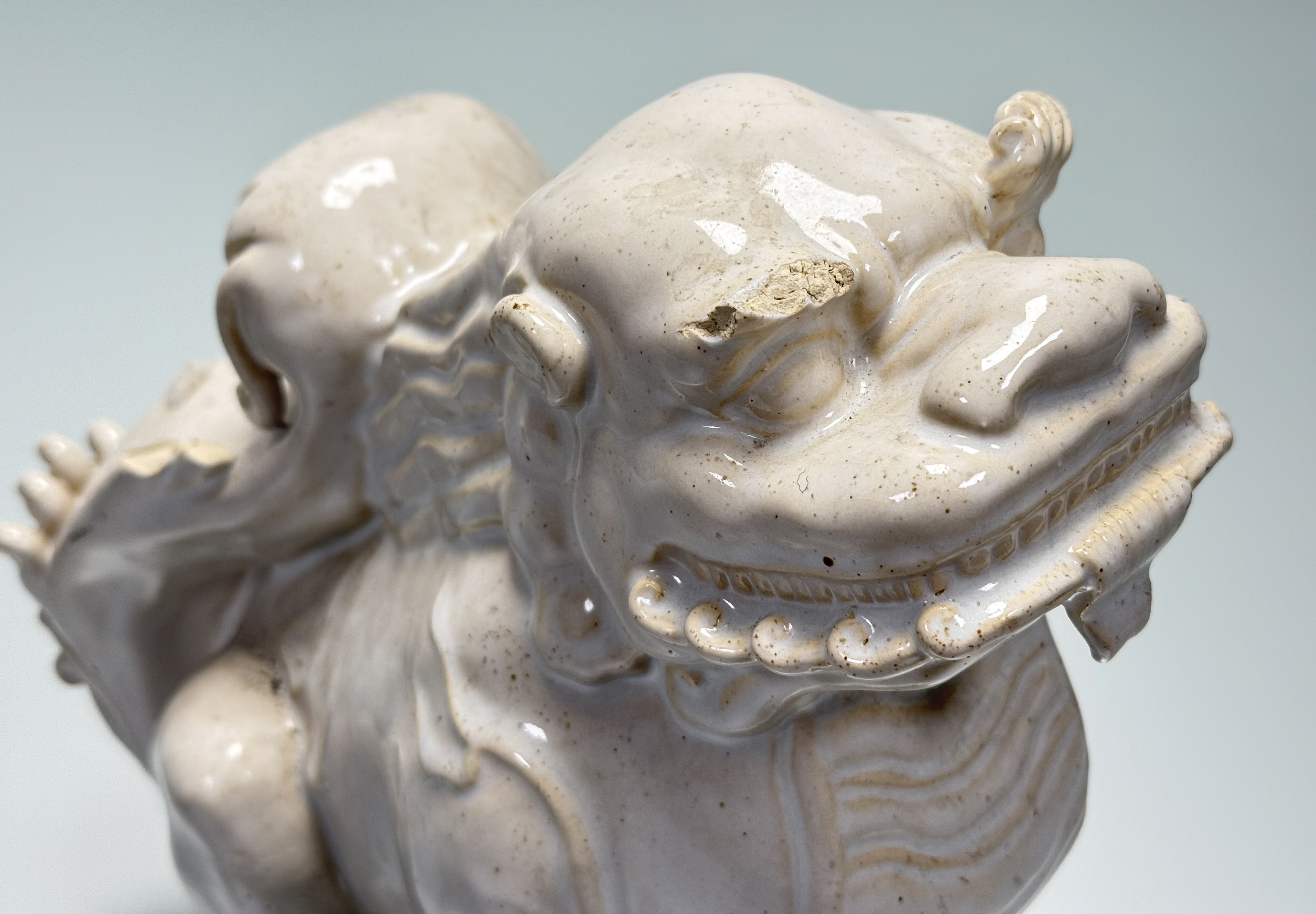 A Chinese white-glazed pottery model of a lion dog, probably 20th century. Height 26cm. - Image 3 of 5