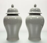 A pair of Chinese celadon-glazed vases and covers, 20th century, of baluster form, unmarked.