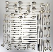 A George III style crossbanded walnut canteen table containing a composed silver flatware service,