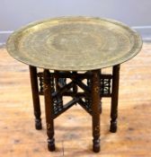 A Middle Eastern hardwood folding table, with mother of pearl inset decoration to stand, with