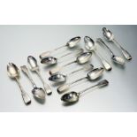 A set of six George IV silver table spoons, Fiddle pattern, London 1820; together with six further