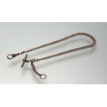 A 9ct gold Albert chain of graduated curb links, with t-bar and lobster clasp. Length 30cm, 24