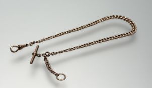 A 9ct gold Albert chain of graduated curb links, with t-bar and lobster clasp. Length 30cm, 24