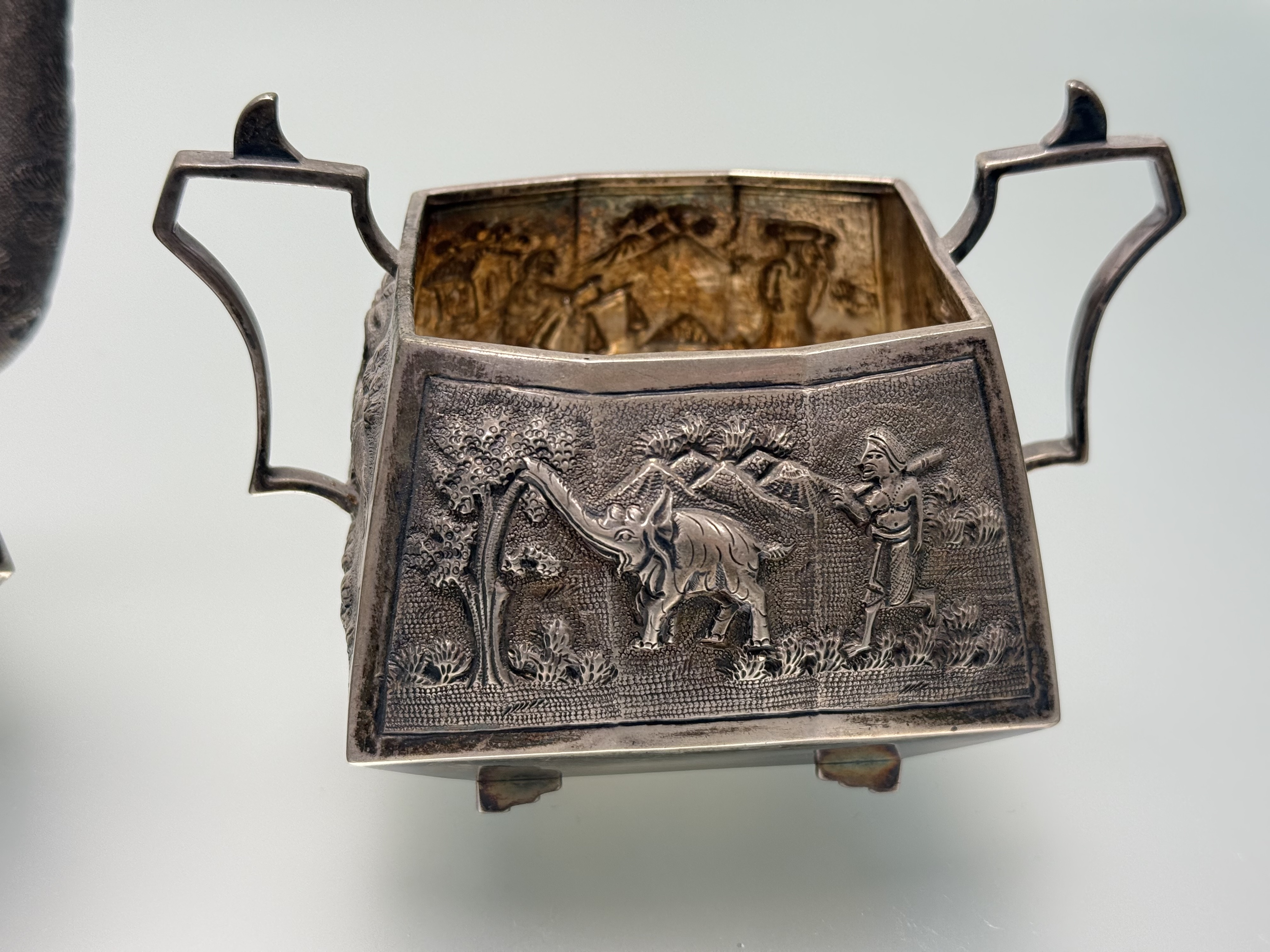 A sterling silver three piece tea service, probably Indian, c. 1900, each piece repousse with - Image 4 of 7