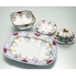 An early 19th century part dinner service polychrome painted with flowers within light blue