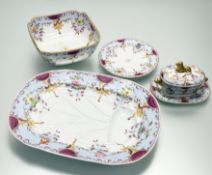 An early 19th century part dinner service polychrome painted with flowers within light blue