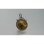 A Victorian full sovereign, 1889, Jubilee Head, in a 9ct gold pendant mount. Total weight 10 grams.