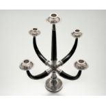 A South-East Asian silver (unmarked) and ebony five-light candelabrum, 20th century, the circular