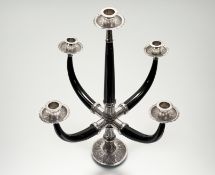 A South-East Asian silver (unmarked) and ebony five-light candelabrum, 20th century, the circular
