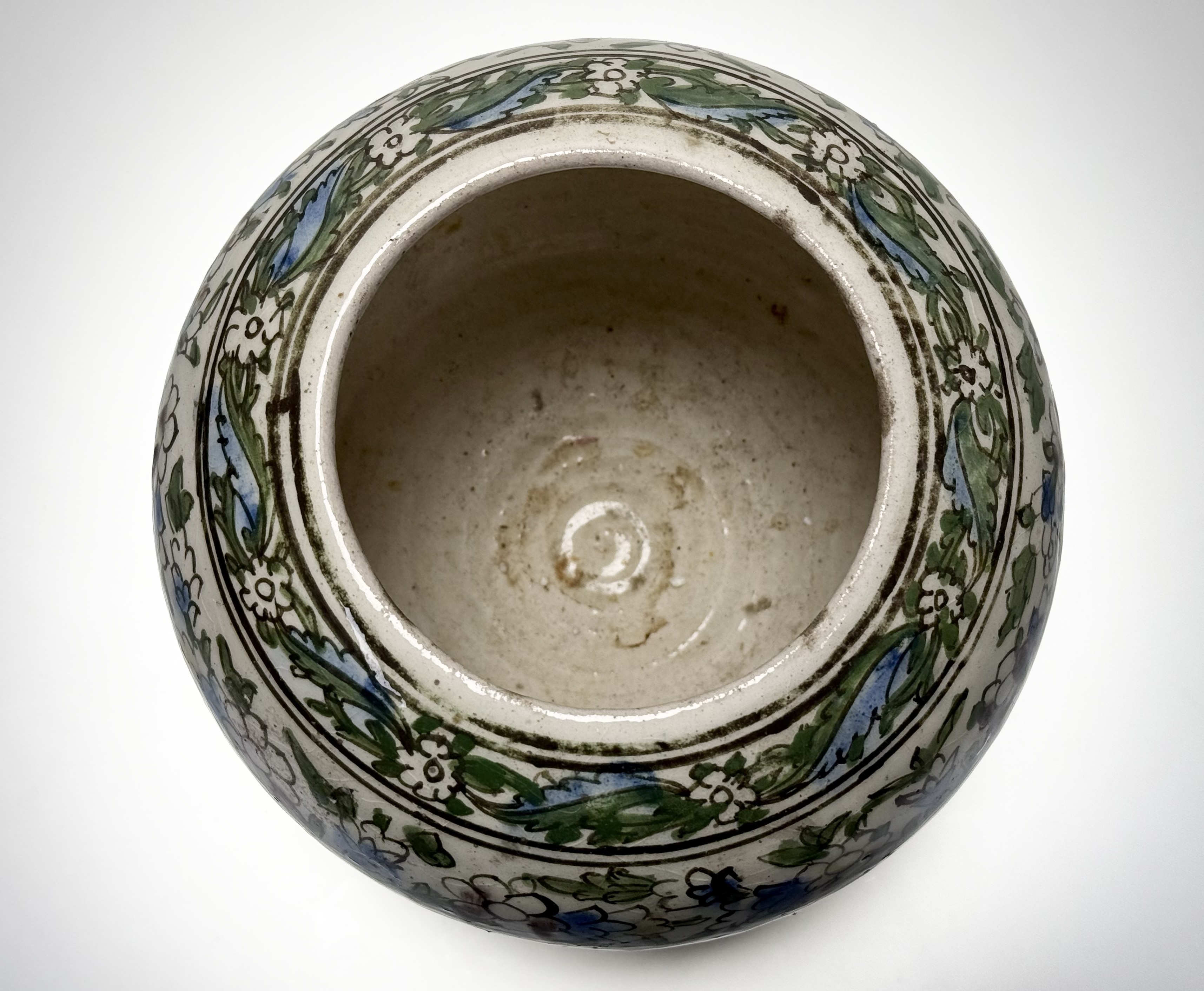 A Persian Qajar style pottery vase, probably early 20th century, painted with flowers and foliage. - Image 4 of 5