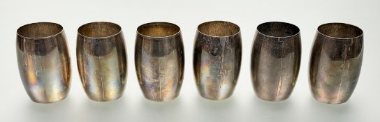A set of six white metal beakers, probably Indian early 20th century, of barrel form, each