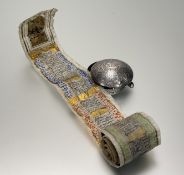 An Islamic (probably Persian) white metal Quran box, 19th century, circular with calligraphic