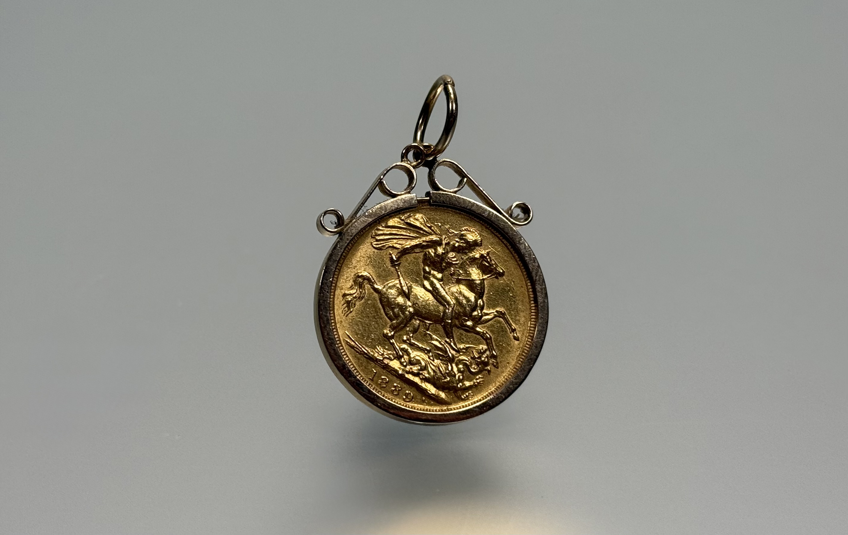 A Victorian full sovereign, 1889, Jubilee Head, in a 9ct gold pendant mount. Total weight 10 grams. - Image 2 of 2