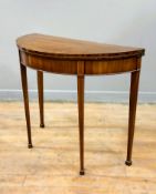 A George III rosewood-crossbanded mahogany demilune card table, early 19th century, with boxwood