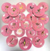 An English pink ground dessert service, third quarter of the 19th century, each piece painted with a