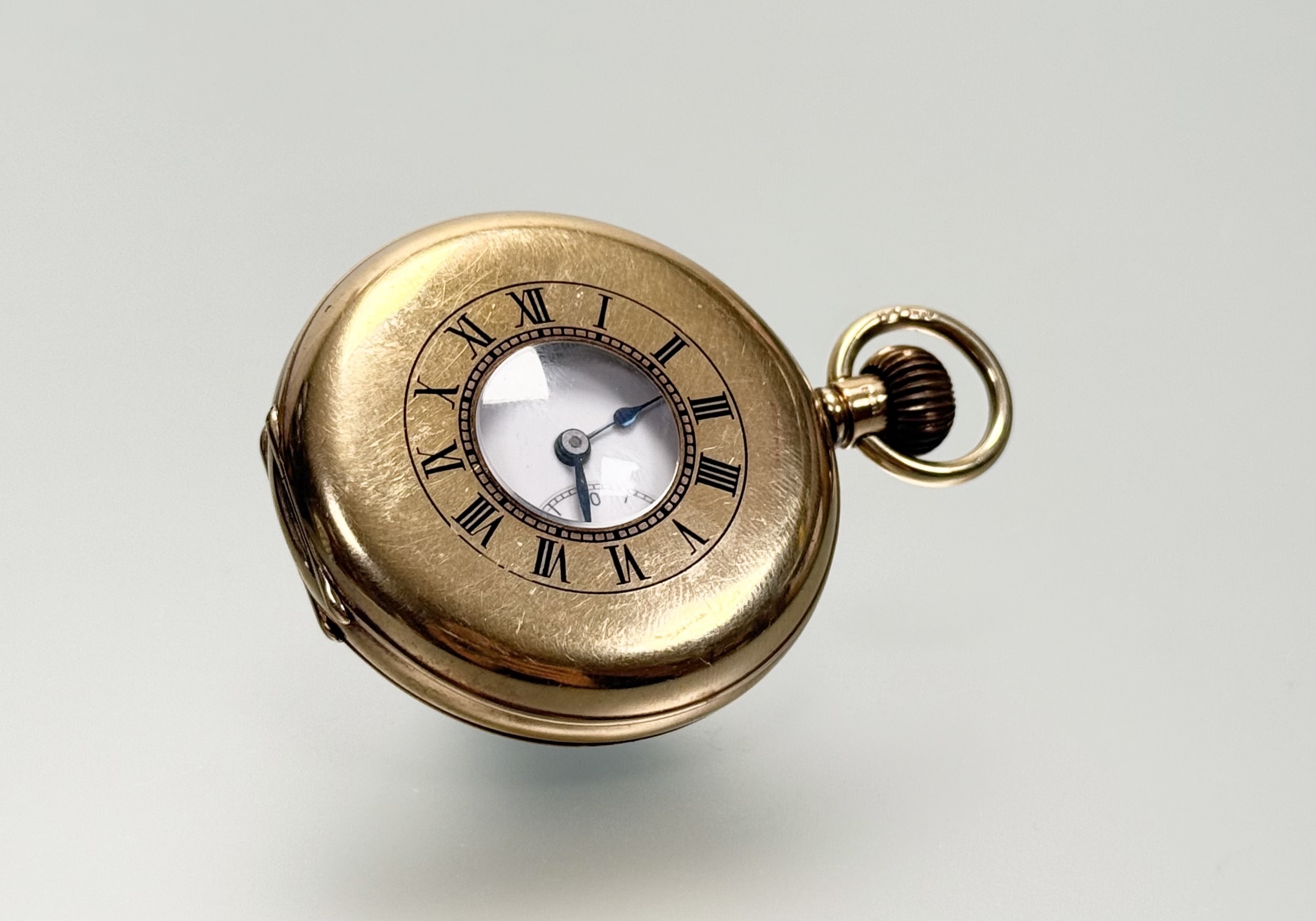 A George V 9ct gold half hunter pocket watch, the case hallmarked for Birmingham 1929, Benson London