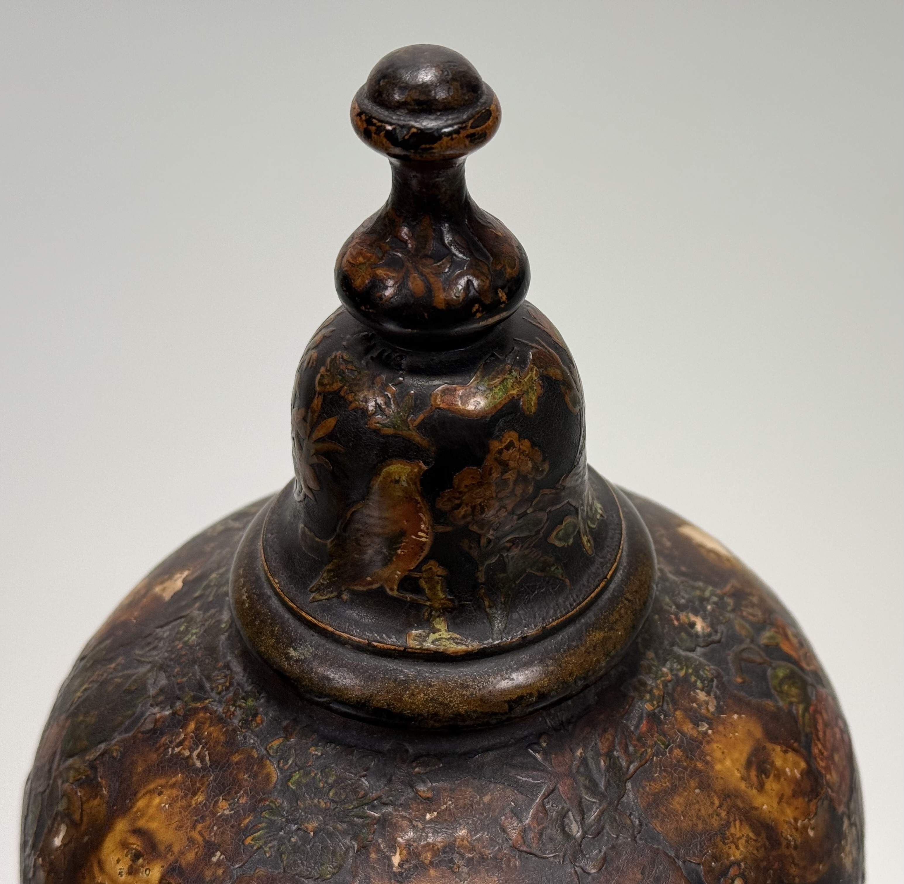 A pair of 19th century decoupage pottery urns, applied with figures and flowers, and with domed - Image 3 of 7