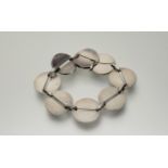 Georg Jensen, a sterling silver bracelet, no.151, designed by Nanna Ditzel, of eight pierced disc-