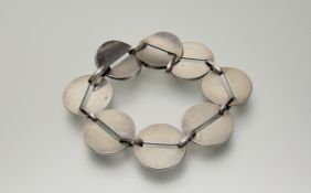Georg Jensen, a sterling silver bracelet, no.151, designed by Nanna Ditzel, of eight pierced disc-