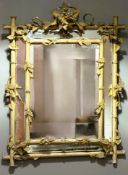 A 19th century painted and parcel-gilt carved wood and composition mirror-framed wall mirror, the