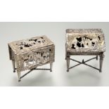 Two pieces of Dutch silver miniature furniture: a bureau with London import marks for 1890, repousse