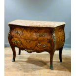 A 20thc. walnut and rosewood veneered bombe commode in the Louis XVI style, with shaped marble top
