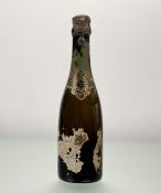 A bottle of Pol Roger Extra Dry 1926, fill level below shoulder, significant losses to labels (c.