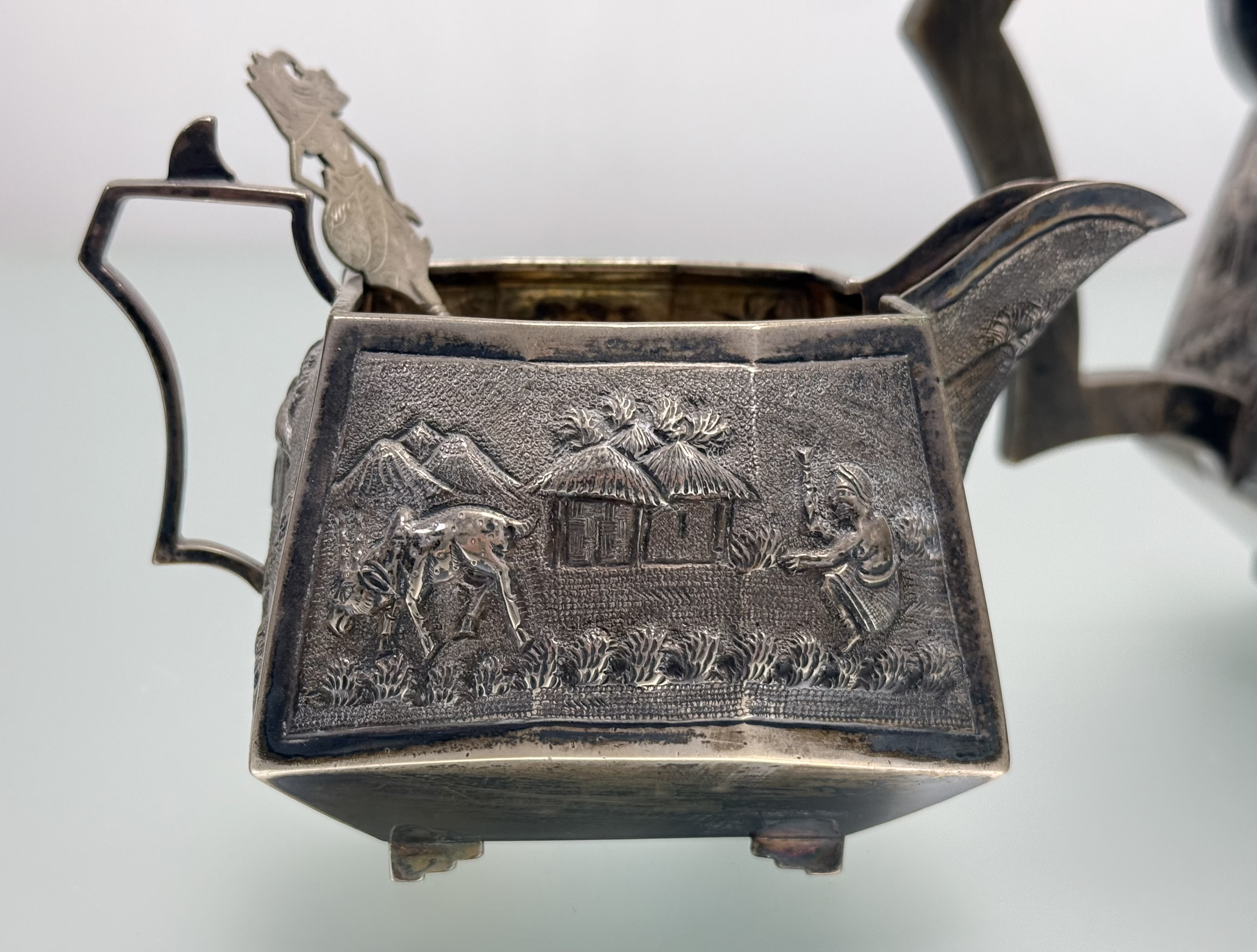 A sterling silver three piece tea service, probably Indian, c. 1900, each piece repousse with - Image 2 of 7