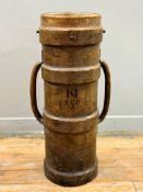 A large First World War leather and cordite shell case, stamped 