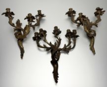 A matched suite of three gilt-bronze wall sconces in the Rococo taste, probably early 20th