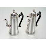 A matched pair of George V silver coffee and chocolate pots in 18th century style, the coffee pot