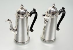 A matched pair of George V silver coffee and chocolate pots in 18th century style, the coffee pot