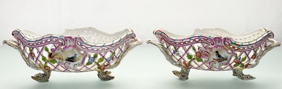 A pair of K.P.M. Berlin porcelain baskets, 19th century, oval, reticulated and floral-encrusted,