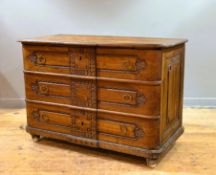 A 19thc French Provincial walnut commode chest, possibly Normandy, fitted three long drawers, on