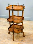 An Edwardian rosewood and fruitwood inlaid three tier etagere with quatrefoil galleried tiers,