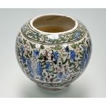 A Persian Qajar style pottery vase, probably early 20th century, painted with flowers and foliage.