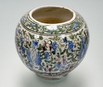 A Persian Qajar style pottery vase, probably early 20th century, painted with flowers and foliage.