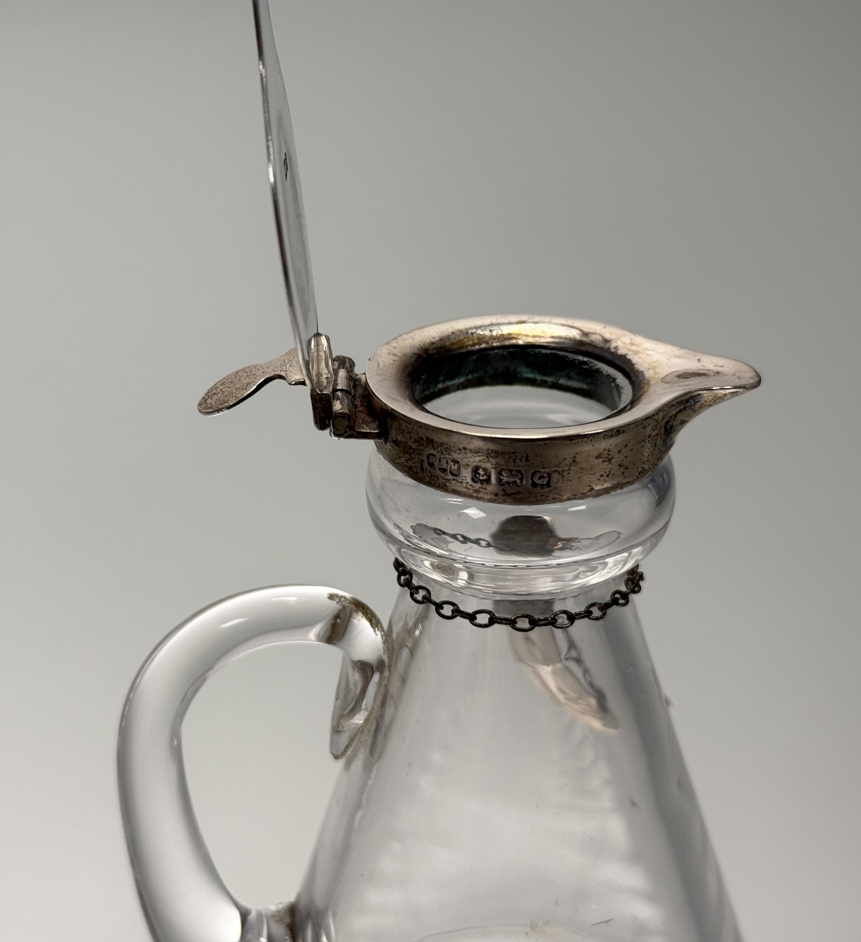 An assembled set of four silver-mounted cut-glass toddy jugs, two Hukin & Heath, Birmingham 1931, - Image 5 of 5