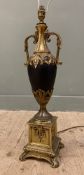 A modern French-style gilt metal table lamp, of urn form with shaped handles and square base: H.