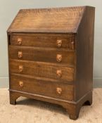 An early 20th century oak bureau, fall-front revealing fitted interior, with four long drawers to