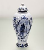 A Villeroy & Boch delft style blue and white lidded vase, with a ship at sea panel scene to