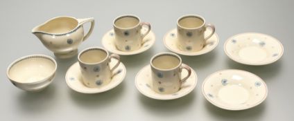 A 1950's Susie Cooper pink and blue star burst pattern part coffee service comprising, a sugar