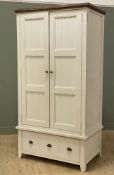 A modern painted pine double wardrobe by Reclaimed, enclosing hanging rail to interior over drawer