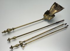 A late 20thc three piece brass metal fire set comprising, a shell shaped shovel, a poker and