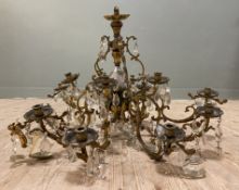 An early 20th century gilt metal chandelier, ten arms with twenty candleholders, cut-glass drops