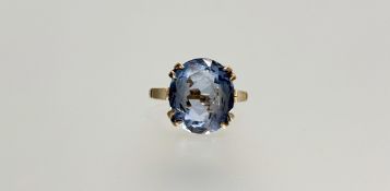 A 9ct gold ring set oval facet cut aquamarine approximately 4ct mounted in four double claw
