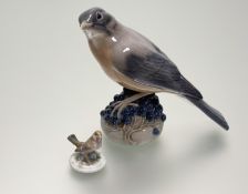 A Royal Copenhagen figure of a Thrush perched on berries, model no. 1235 (h-13cm) together with a