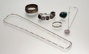 An Edwardian Birmingham silver stiff-hinged bangle with engine turned basket weave decoration and